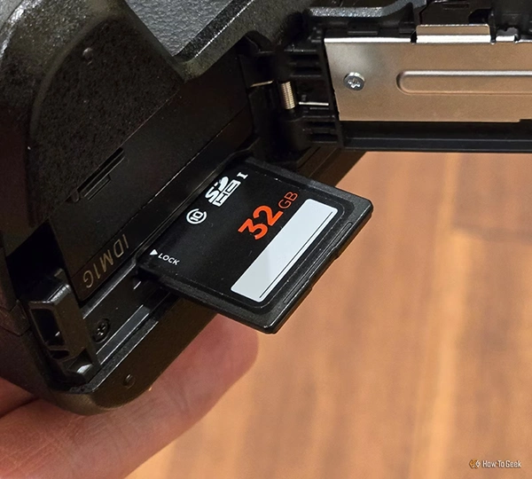 Insert the SD card into your cameras built-in slot